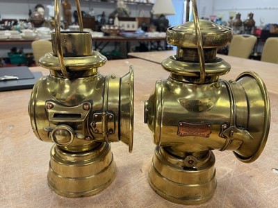 Lot 604 - Three various vintage brass carriage lamps,...