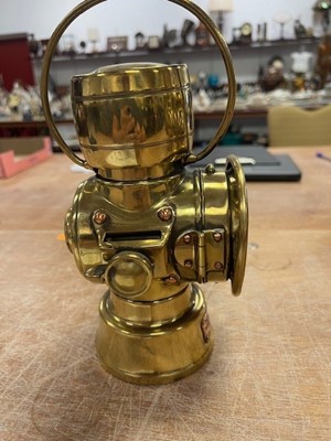Lot 604 - Three various vintage brass carriage lamps,...