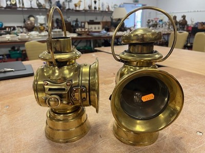 Lot 604 - Three various vintage brass carriage lamps,...