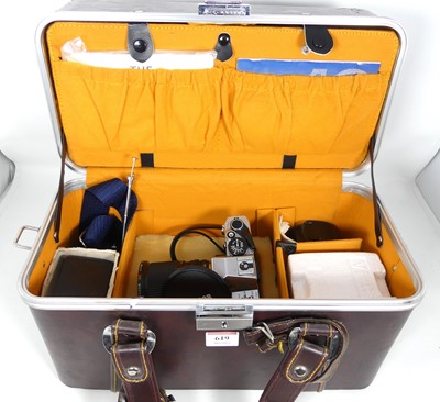 Lot 619 - A vintage Olympus OM10 SLR camera, cased with...