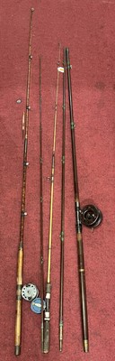 Lot 738 - A collection of vintage fishing rods