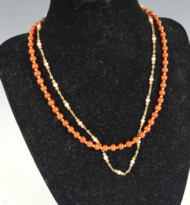 Lot 2604 - A contemporary yellow metal beaded coral...