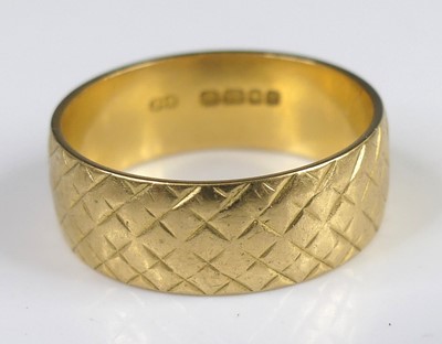 Lot 2763 - A modern 18ct gold wedding band, of...