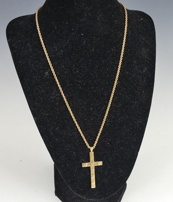 Lot 2769 - A modern 9ct gold cross pendant with applied...