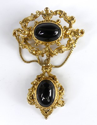 Lot 413 - A Victorian style 9ct gold and cabochon onyx...