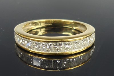 Lot 2615 - A 9ct yellow gold diamond half-hoop eternity...