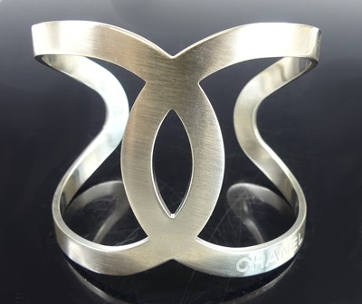 Lot 2709 - A Chanel-CC logo open cut-out B17V cuff bangle,...