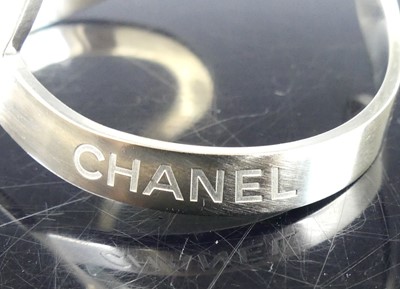 Lot 2709 - A Chanel-CC logo open cut-out B17V cuff bangle,...