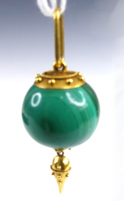 Lot 2647 - A yellow metal and malachite ball pendant with...