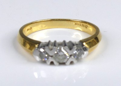 Lot 2654 - A modern 18ct gold diamond three-stone ring,...