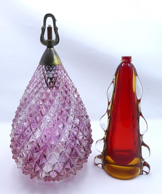 Lot 128 - A moulded and pink tinted glass teardrop...