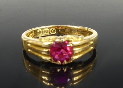 Lot 2656 - An 18ct gold ruby solitaire ring, the claw set...