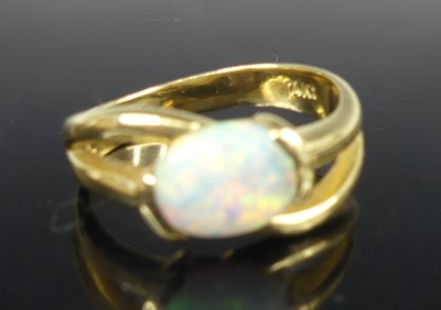 Lot 2660 - A modern 14ct gold opal set dress ring, the...