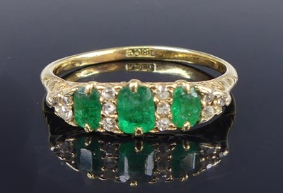 Lot 2713 - An 18ct gold, emerald and diamond ring, in...