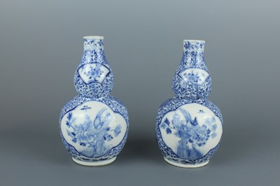 Lot 1 - A pair of Chinese blue and white double gourd...