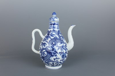 Lot 2 - A Chinese blue and white “dragon” ewer, Qing...