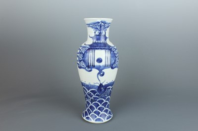 Lot 6 - A Chinese blue and white “fish” baluster vase,...