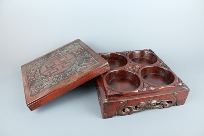 Lot 33 - A Chinese carved wooden box with lacquer paint,...