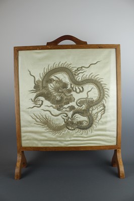 Lot 45 - An imposing embroidered “dragon” silk panel in...