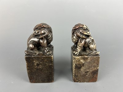 Lot 46 - A pair of Chinese soapstone lion seals,...