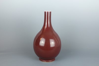 Lot 57 - A Chinese sang-de-boeuf glaze bottle vase,...