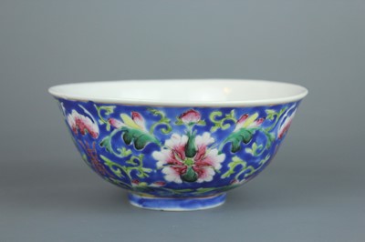 Lot 71 - A Chinese famille rose blue ground “flowers...