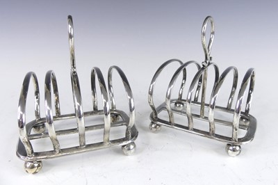 Lot 155 - A pair of Art Deco silver four-division toast...