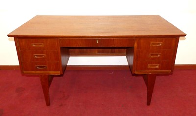 Lot 436 - A 1960s Danish teak kneehole writing desk, the...