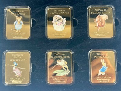 Lot 3292 - The World of Peter Rabbit, gold plated ingot...