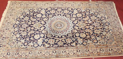 Lot 1169 - A Persian woollen cream and blue ground Nain...