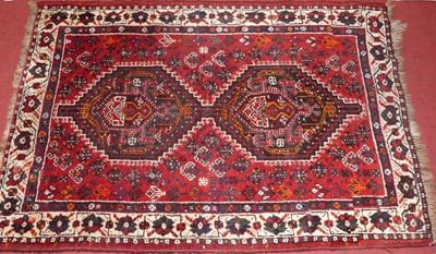 Lot 1159 - A Persian woollen red ground Hamedan rug, the...