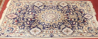 Lot 1168 - A Persian woollen cream and blue ground Nain...