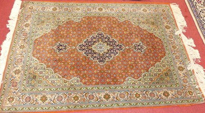 Lot 1161 - A Persian woollen red and green ground Keshan...