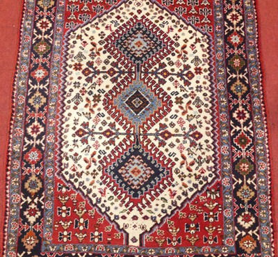 Lot 1163 - A Persian woollen red, white and blue ground...