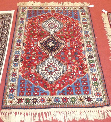 Lot 1170 - A Persian woollen red, white and blue ground...