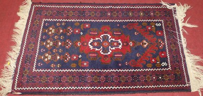 Lot 1165 - A Turkish woollen blue and red ground Kazak...