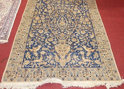 Lot 1175 - A Persian woollen blue ground Shahreza rug,...