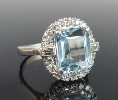 Lot 2228 - A white metal aquamarine and diamond oval...