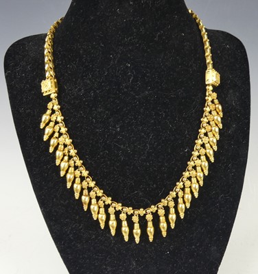 Lot 2219 - A yellow metal necklace, comprising open...