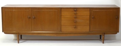 Lot 458 - A 1960s teak long sideboard, having five...