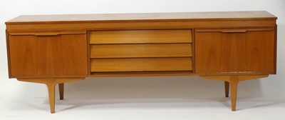 Lot 459 - A 1960s teak long sideboard, having three...