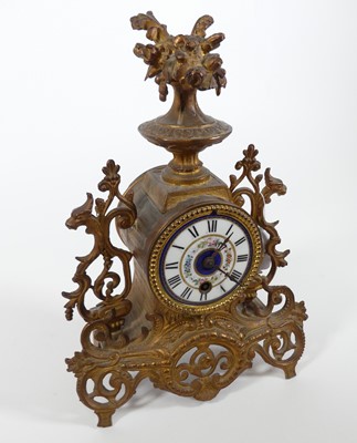 Lot 3 - A 19th century gilt metal mantel clock, the...