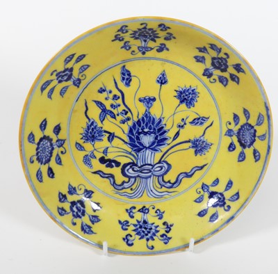 Lot 4 - A Chinese blue and yellow glazed dish,...