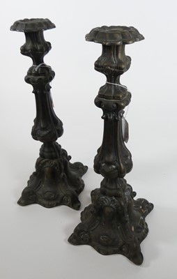 Lot 7 - A pair of cast metal candlesticks, 20th...