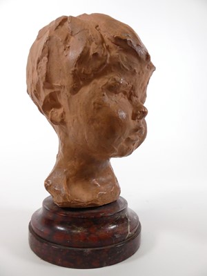 Lot 13 - A terracotta head of a boy, mounted upon a...