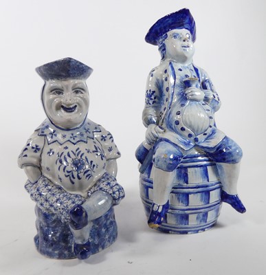 Lot 19 - A Delft blue and white figural jug, h.33cm;...