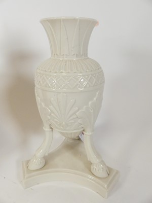 Lot 32 - A Belleek porcelain vase, standing upon three...