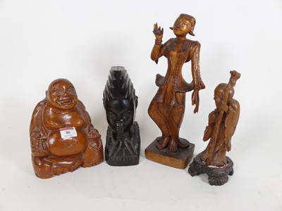 Lot 46 - A collection of four Asian carved hardwood...