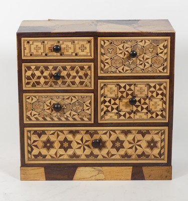 Lot 59 - A Japanese specimen inlaid table-top chest,...