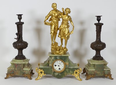 Lot 113 - An early 20th century gilt metal and onyx...